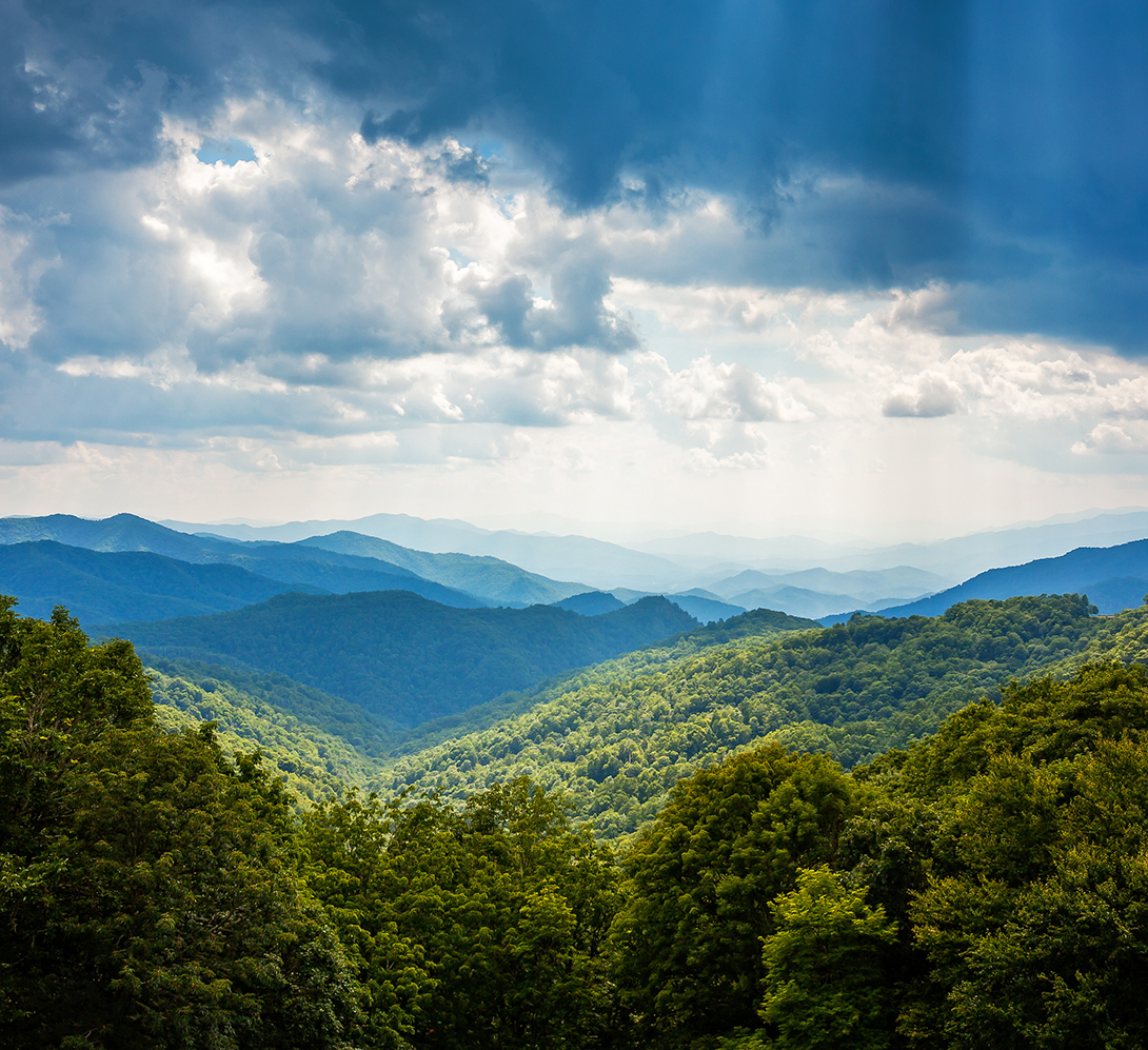 Sunbeams and storm clouds in the Appalachian Mountains along Blue Ridge Parkway in Asheville, North Carolina